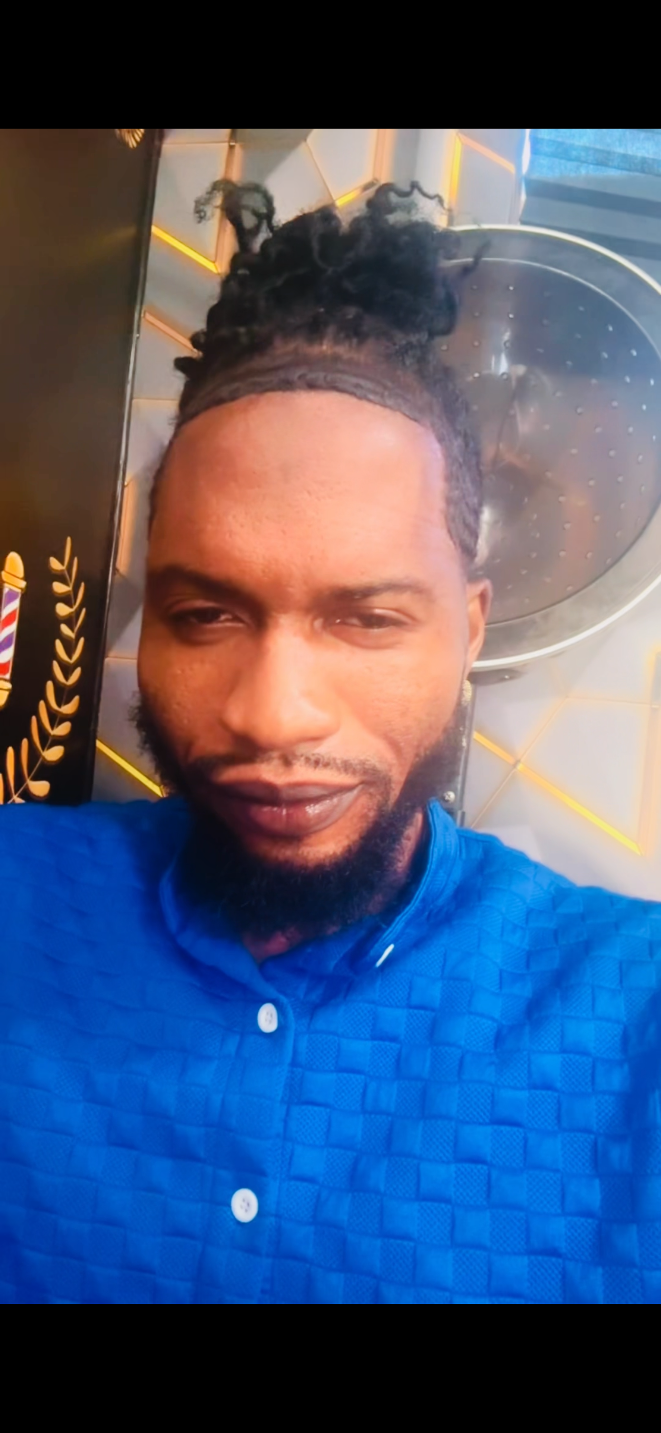 Kevin Santos, owner and barber of The Most Gifted Palms